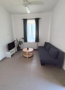 a living room with a couch and a table at Horizon in Kýthira