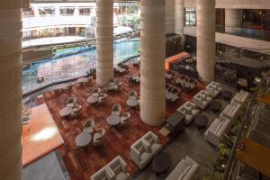 an overhead view of a lobby with chairs and a pool at Grand Hyatt Fukuoka in Fukuoka