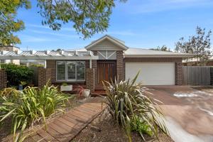 a brick house with a garage at Saltwater in Anglesea