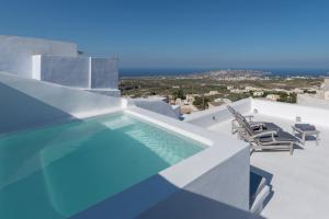 a swimming pool on the roof of a house at Sensation Villa - by Senses Collection in Pirgos