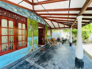 an image of a house with a pool at Malmika Villa in Ahangama