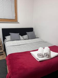 Postel nebo postele na pokoji v ubytování Urko Apartments Ljubljana