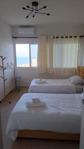 Ένα ή περισσότερα κρεβάτια σε δωμάτιο στο Bright appartment