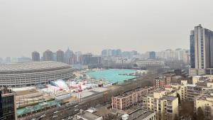 a city with a pool in the middle of a city at Beijing Sanlitun Shimao International Serviced Apartments in Beijing