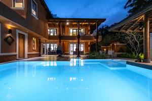 a large swimming pool in front of a house at VILLA DIVA STAR in Ko Yao Noi +69 photos