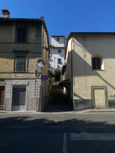 a stairway leading up to a building with a building with a stairway at Sweet Home Sweet Wine in Lastra a Signa
