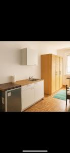 a kitchen with a sink and a stove at Beenie in Linz