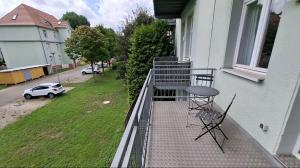 a balcony with a table and a chair on it at Loft with balcony Enckekaserne in Magdeburg