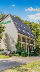 a building with solar panels on the side of it at Equilibrium Restart in Piatra Neamţ
