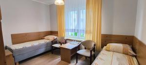 Postel nebo postele na pokoji v ubytování Słoneczny Brzeg