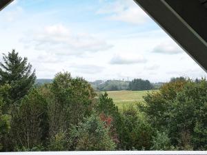 a view of a field and trees from a tent at 10 person holiday home in Fur-By Traum in Fur