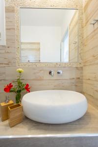 a large white sink in a bathroom with a mirror at Villa Lena in Stelida +52 photos