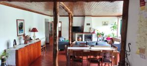 a living room with a table and a couch at Casa da Benda in Caniçada