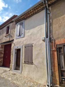 an exterior view of a house with windows at 17th CENTURY HOUSE with terrace, near to Castle in Capendu +14 photos