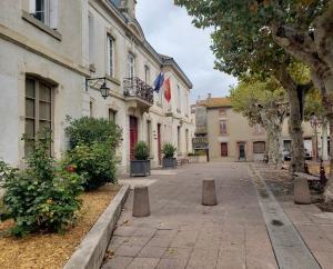 an empty street in a city with buildings at 17th CENTURY HOUSE with terrace, near to Castle in Capendu