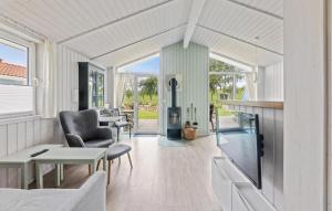 a living room with a fireplace in a house at Friedrichskoog-Deichblick 4 in Friedrichskoog
