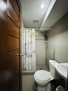 a small bathroom with a toilet and a sink at Sunset Island View Villa El Nido in El Nido