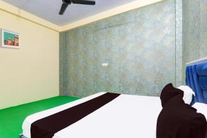 Ένα ή περισσότερα κρεβάτια σε δωμάτιο στο Hotel O Shagun palace +21 φωτογραφίες