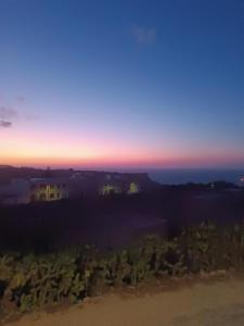 a view of the sunset from a hill at Boscolo Flats Nadur - Modern Rooms with private en-suite bathrooms in Nadur