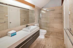 a bathroom with a sink and a toilet at Beachside Retreat, WIFI, Kayaks, AC to all rooms in Dunsborough +11 photos