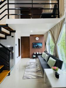 a living room with a couch and a table at Sunset Island View Villa El Nido in El Nido