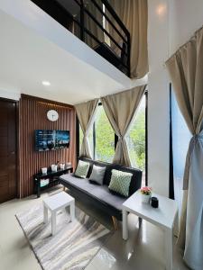 a living room with a couch and a table at Sunset Island View Villa El Nido in El Nido +45 photos