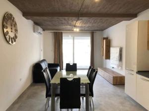 a kitchen and dining room with a table and chairs at Seafront place Spinola StJulians in St. Julianʼs