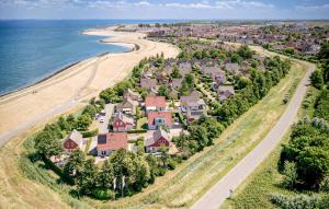 an aerial view of a large house next to the beach at 3 Bedroom Cozy Home In Wemeldinge in Wemeldinge +13 photos