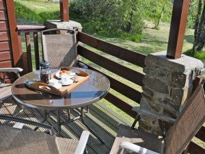 a table with a tray of food on a patio at Hawthorne in Woolfardisworthy