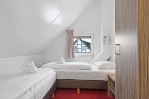 Ένα ή περισσότερα κρεβάτια σε δωμάτιο στο Landal Winterberg +30 φωτογραφίες