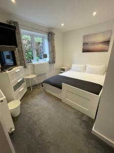Ένα ή περισσότερα κρεβάτια σε δωμάτιο στο Bed and breakfast near Truro and the A30