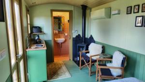 a tiny house with a sink and a bathroom at Tiny House at Villa Ariola in Irola