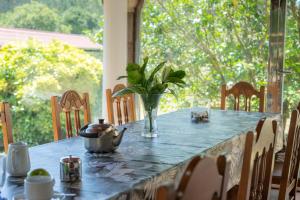 a table with a vase on top of a table at Casa de Trillo Galitrips in Rego de Santa Marina +45 photos