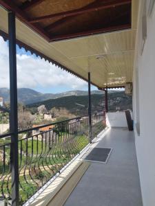 a balcony with a view of the mountains at Demir Apart Otel in Kaş