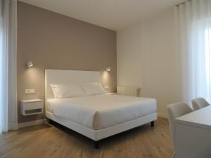 Ένα ή περισσότερα κρεβάτια σε δωμάτιο στο Sunset Maida