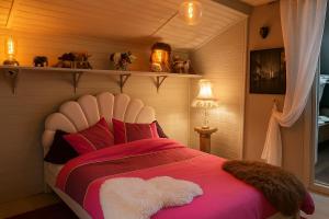 Ένα ή περισσότερα κρεβάτια σε δωμάτιο στο Chalet Le Puy Papillon