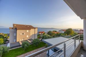 a view from the balcony of a house at Apartments Villa Residenca in Novi Vinodolski