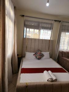 Ένα ή περισσότερα κρεβάτια σε δωμάτιο στο Studio nyali apartment