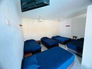 a room with blue couches in a room at Hotel Girardot La Ciudad Del Sol in Girardot