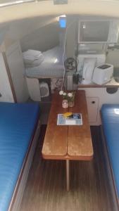 a small room with a table and a bed at Lisboa Barco Notus Belém in Lisbon
