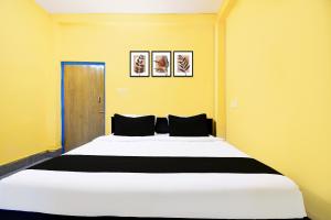 Ένα ή περισσότερα κρεβάτια σε δωμάτιο στο Hotel O Prava Inn