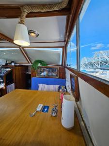 a table in a boat with a view of a bridge at Lisboa Barco Corleone in Lisbon +32 photos