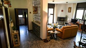 a living room with a couch and a table at Casa Sala in Castionetto di Chiuro