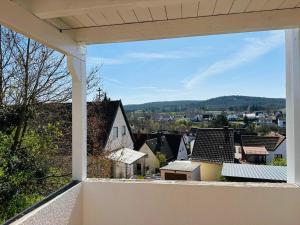 a view of a city from the balcony of a house at Sehr gut ausgestattetes Einfamilienhaus in Hochspeyer