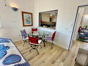 a dining room and kitchen with a table and chairs at Vila Vista Luz in Lagos +56 photos