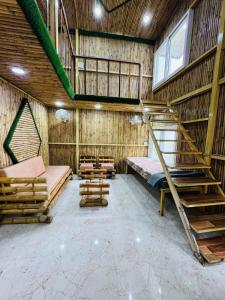 Μία ή περισσότερες κουκέτες σε δωμάτιο στο Euphoria Stays-A Bamboo House +27 φωτογραφίες