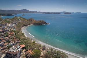 an aerial view of a beach next to the ocean at Las Catalinas Doorway in Playa Flamingo