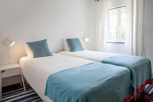 Postel nebo postele na pokoji v ubytování Casa dos Pinheiros + 20 fotografií