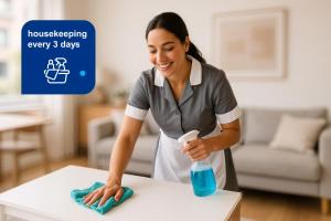 a woman cleaning a table with a blue detergent bottle at Family Apartment with Puente de la Mujer View in Puerto Madero in Buenos Aires