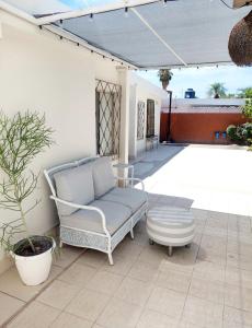a patio with a chair and a table on a patio at Escala Norte in Hermosillo